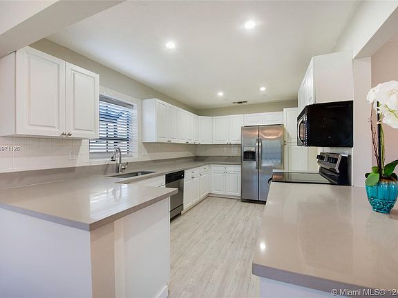 Large kitchen with lots of counter space. 