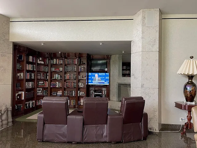 TV alcove with motorized reclining leather lounge chairs