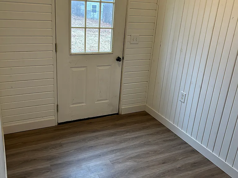 LAUNDRY AREA HAS AN OPEN LANDING WHICH LEADS TO THE BACK YARD AND A WONDERFUL SPACE FOR ADDITIONAL STORAGE