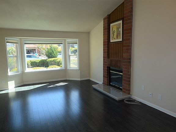 The wide picture bay window floods the interior with warm natural light.  Can you see your Christmas tree in the corner... and t