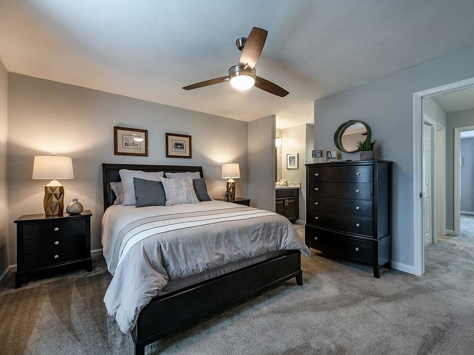 Bedroom with queen bed, dresser and night stands