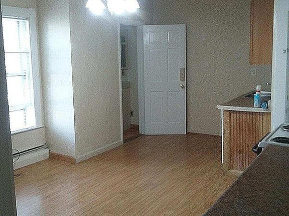 Spacious Kitchen with Oak laminate flooring & oak cabinetry.