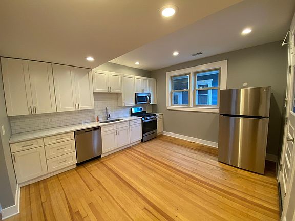 Eat in kitchen with brand new stainless steel appliances, and brand new cabinets with matching hardware. Access to terrace in rear of building.
