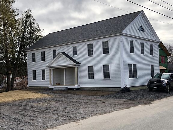 This photo was taken in March 2019. Since that time, the parking area has been paved, the lawn is in and landscaping beds have been installed.
