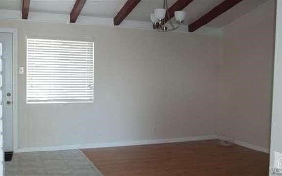 Living room view from entry hall. New window(s), blinds & door to back yard. So neat & clean!