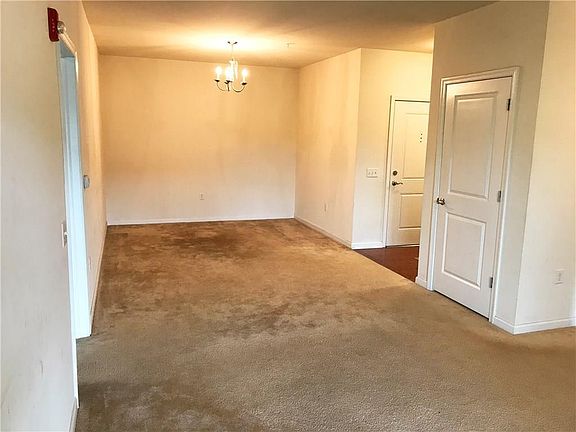 Spacious living room & dining room with access to the balcony.