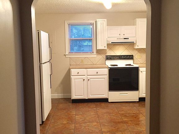 From bedroom door to kitchen, bathroom on right