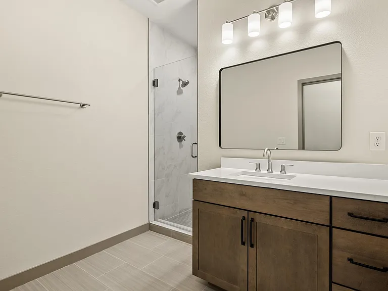 Master bathroom with walk in shower and private toilet room