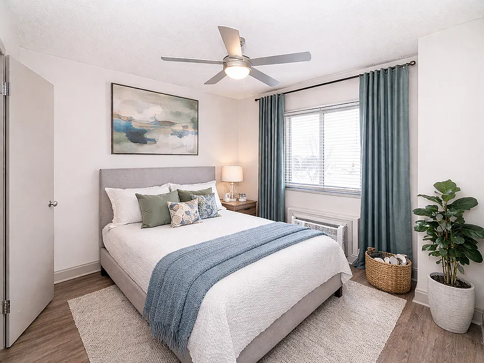 Bedroom with hardwood-style flooring & ceiling fan