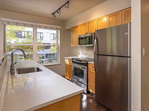 Kitchen with Stainless Steel Appliances and Quartz Countertops
