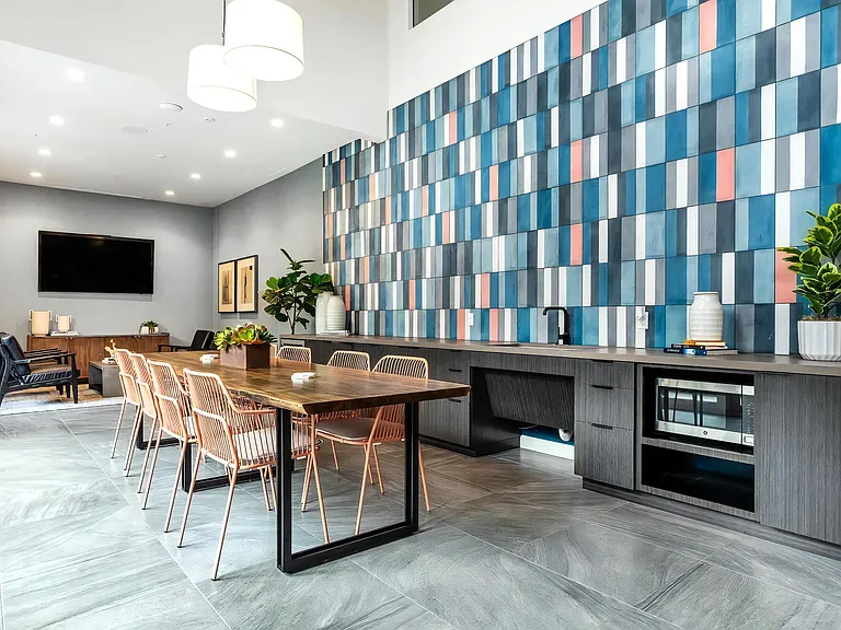 Clubhouse Lounge with Bar Seating and Entertainment Area