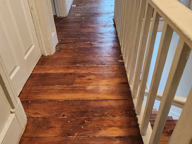 upstairs hallway - hardwood floors and newer windows