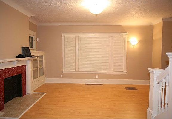 The main picture window in the living room, as seen from the dining room.