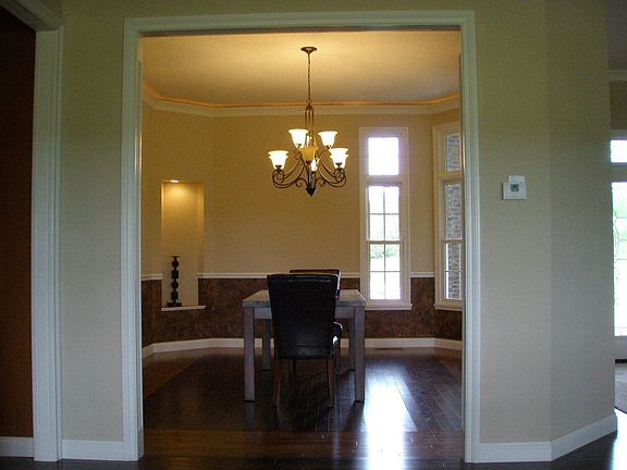 Dining Room with perimeter lighting above crown