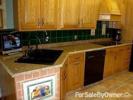 KITCHEN
						:
						All new granite counters, new stove top and sink.Custom tile floor.