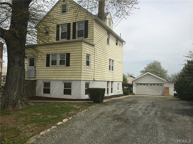 front exterior, extra large driveway & 2 car garage