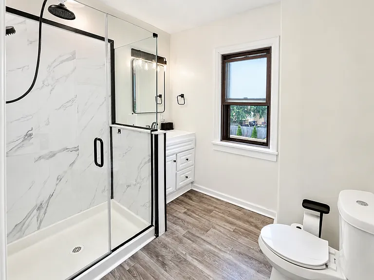 Updated bathroom with walk-in shower and modern finishes