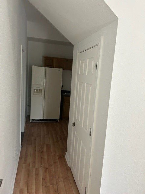 Walking from living room to kitchen. Large storage closet.