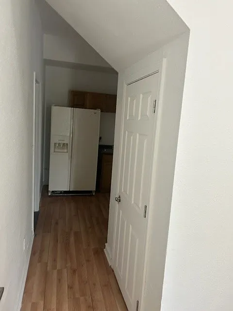 Walking from living room to kitchen. Large storage closet.