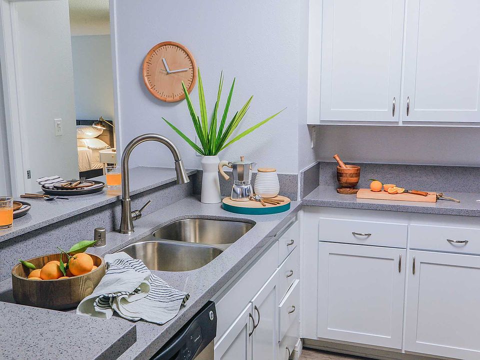 Gourmet kitchen with designer shaker-style cabinetry and quartz countertops