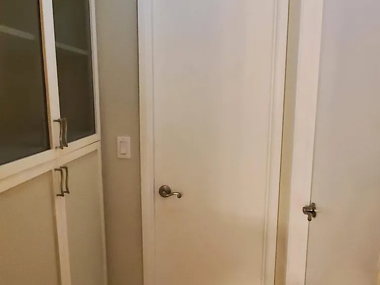 hallway leads to second bedroom and second bathroom