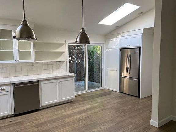 Open kitchen with stainless steel appliances