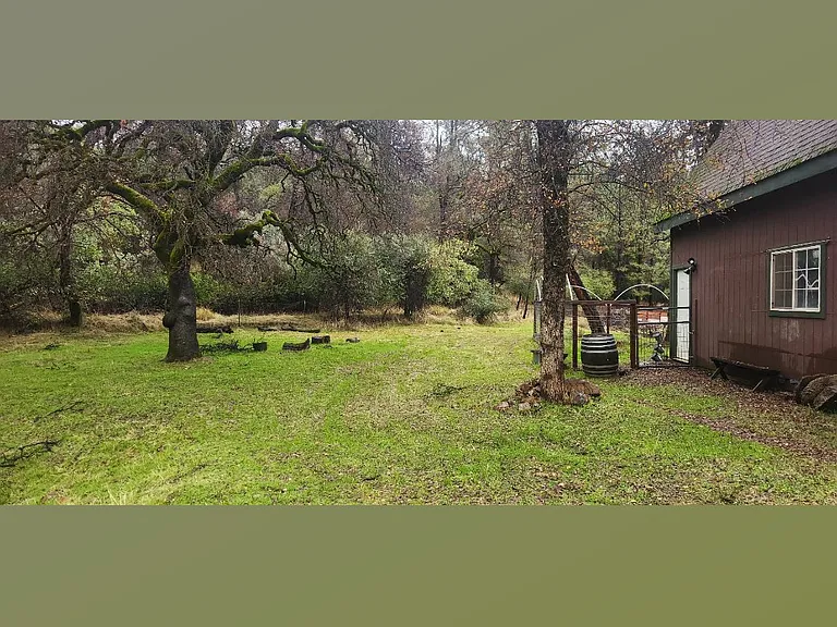 Entrance and small fenced back yard.