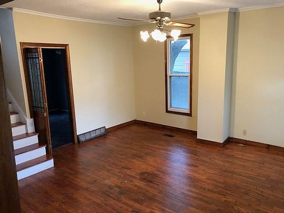 Living room, door to downstairs bedroom