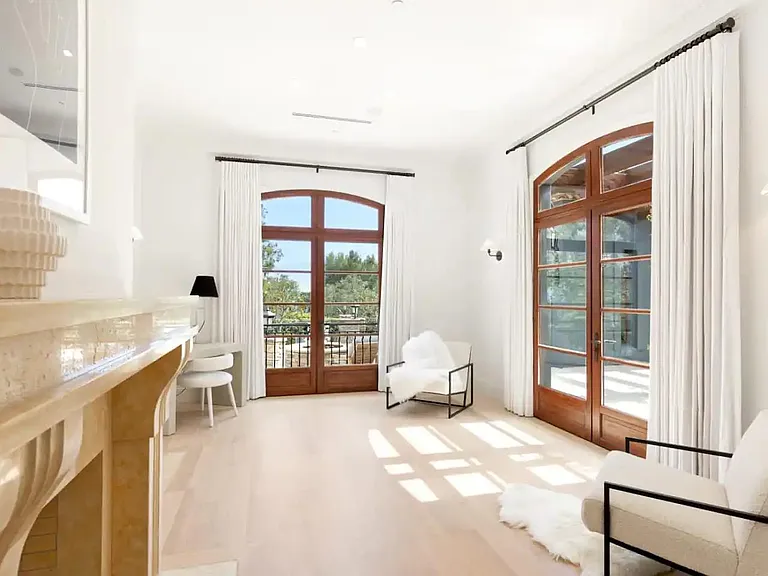 Bright primary suite with desk