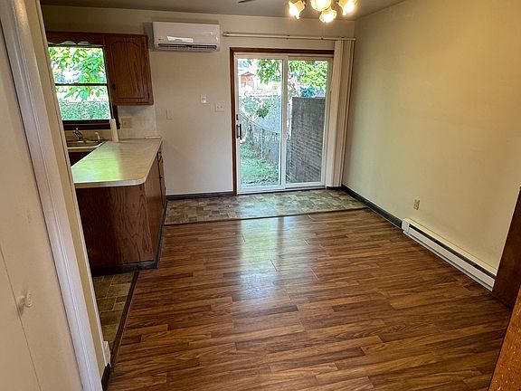 Dining area with walk out to back porch and fenced in yard