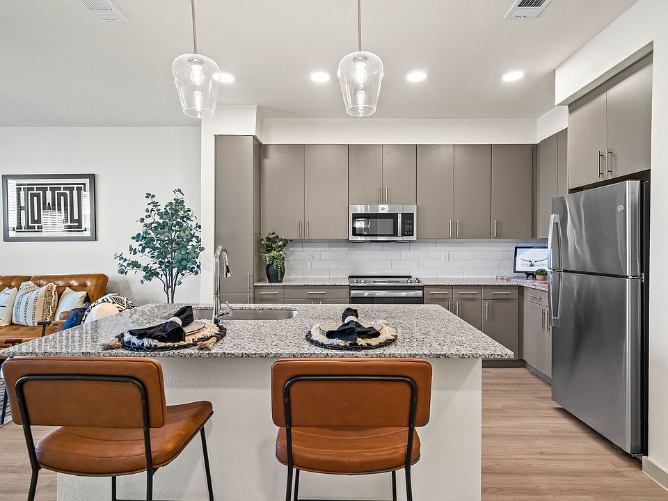 Stainless Steel Appliances and Gray Cabinets