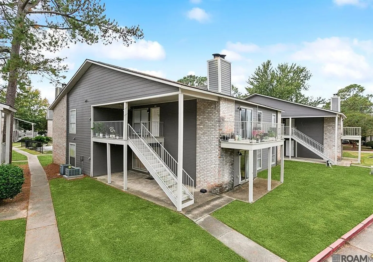 Welcome home to this charming 2-bedroom, 2-bath downstairs unit in the heart of Baton Rougejust m... — Photo 1