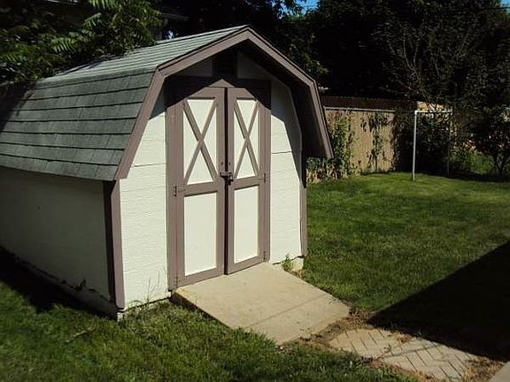 Tool/mower shed in backyard