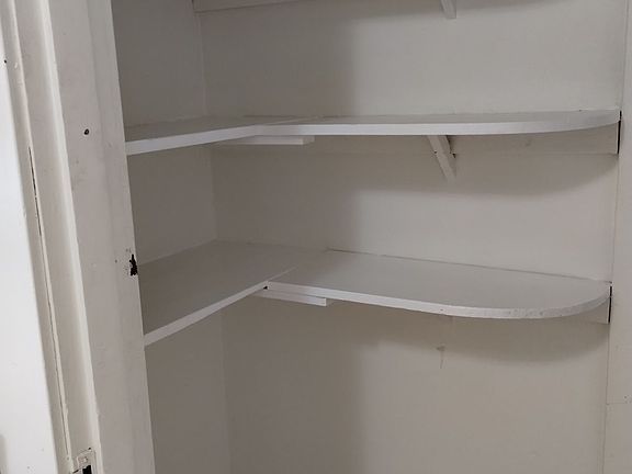 Lots of shelf storage right off the kitchen.