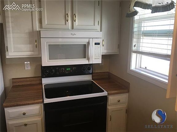This view point is from the dining room thru the large opening over the sink which is very convenient for passing food dishes to family or guests without them even having to enter the kitchen which every cook appreciates!