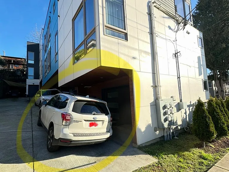 Parking space behind the single car garage