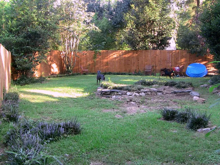 Huge back yard with 6 foot privacy fence.