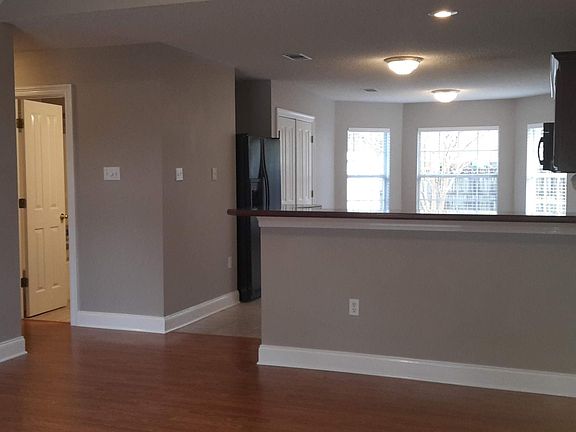 Kitchen and dining. Door to hall bath.
