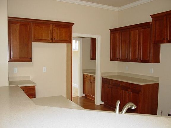 KITCHEN IS OPEN TO BREAKFAST AREA AND FAMILY ROOM