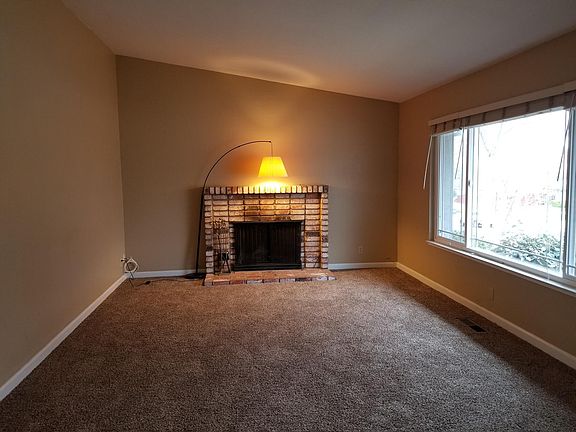 Living room with wood burning fireplace