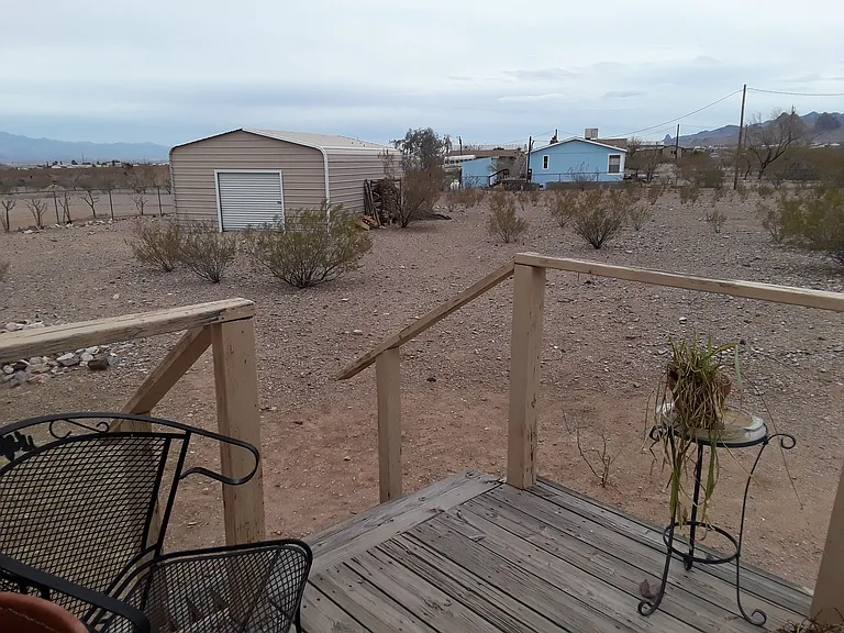 Laundry Room Deck Looking onto Large Back Yard
Firewood stand side of Garage