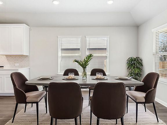 Virtually staged dining room in Preston floorplan at a Meritage Homes community.