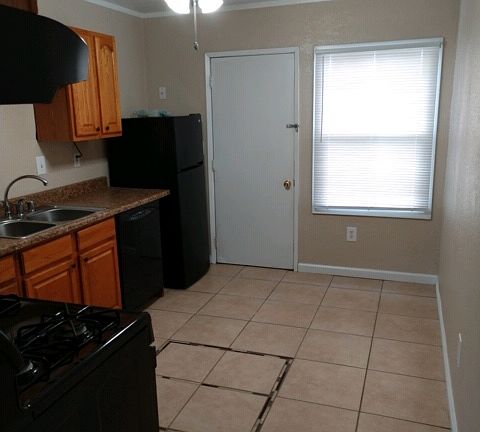 Tiled kitchen with gas stove