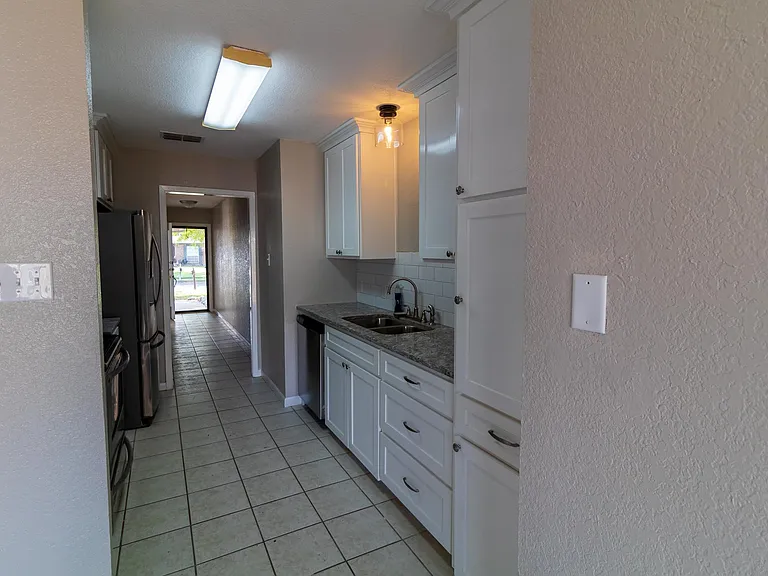 Note: Refrigerator in photo is no longer there. It will be a different refrigerator that is provided as a courtesy item.