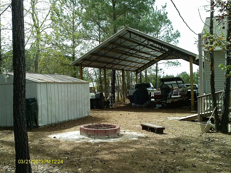Storage shed, back view of carport. (Fire-circle is no longer there.)