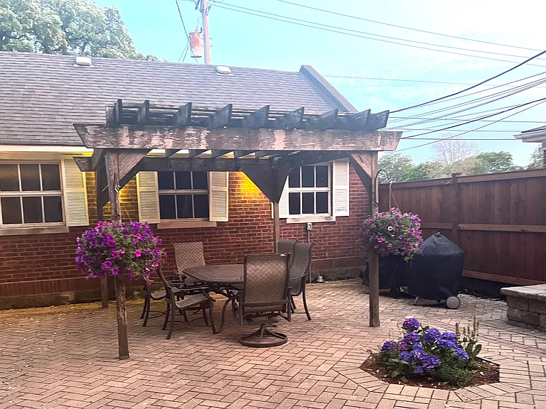 Rear Patio pergola. Gas grill and Weber grill.