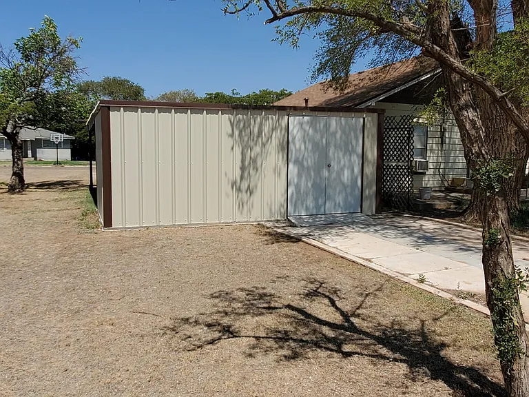 Storage with electricity on the back side of the house.