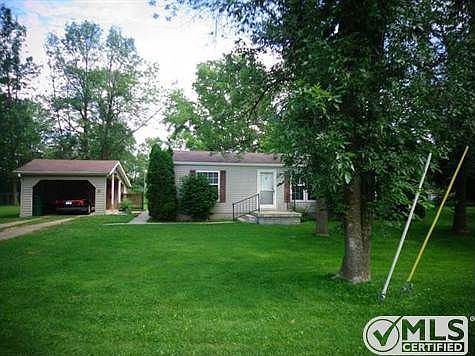 House and carport with storage