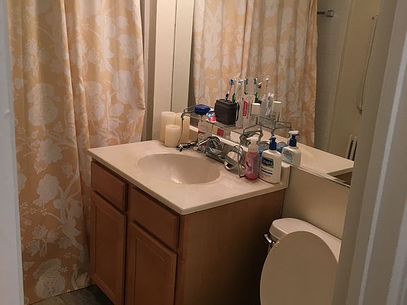 Bathroom with large wall mirror