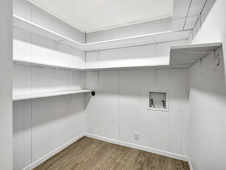 Giant utility room with endless shelves!